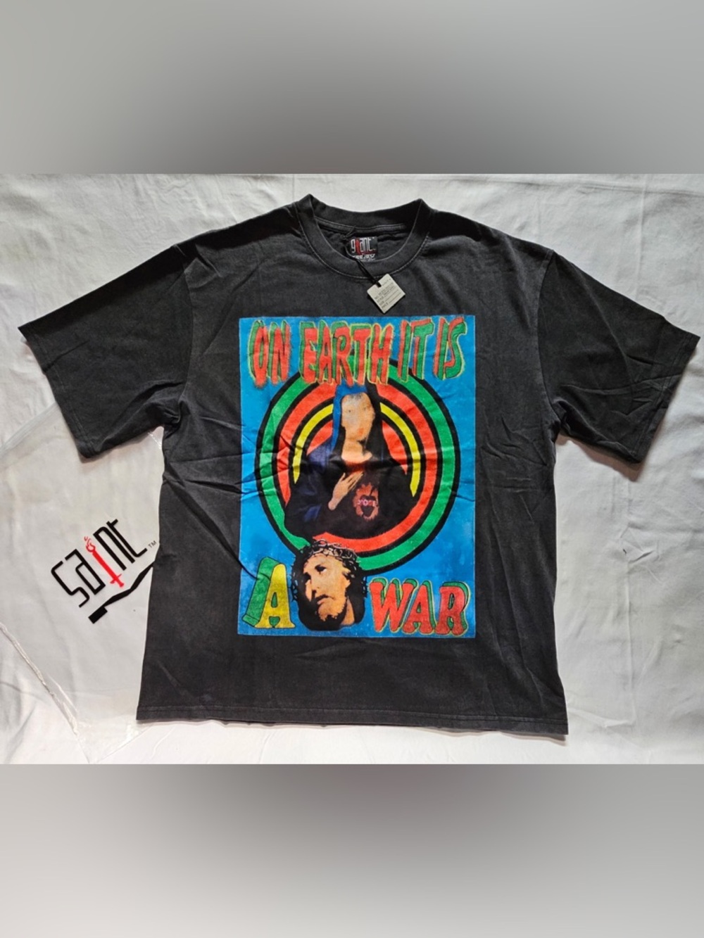 Saint Michael Black  Graphic Tee with Colorful 'On Earth It Is A War' Print